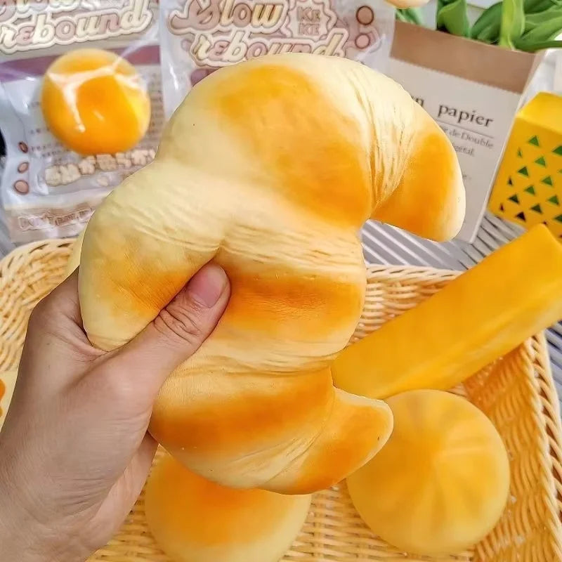 Croissant-Squishy-Stressball – Weiches Klebriges Slow-Rising Brot-Knautsch-, Fidget- & Sensorikspielzeug für Entspannung & Partygeschenke Kaufschwan®